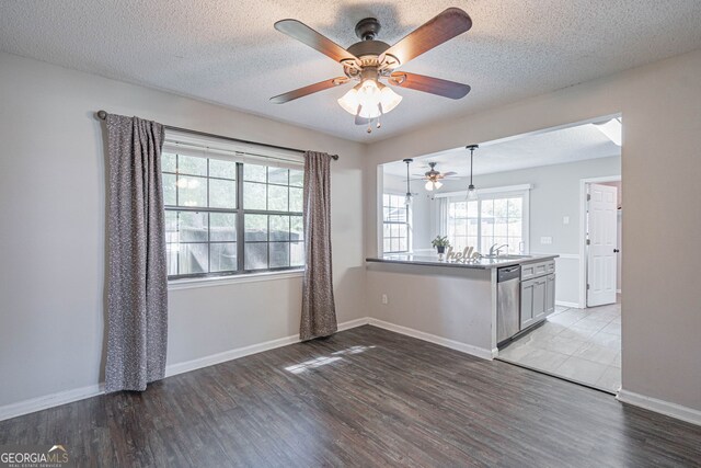 755 Madison Dr, Hinesville, GA 31313 - spare room featuring ceiling fan, wood finished floors, a sink, baseboards, and a textured ceiling