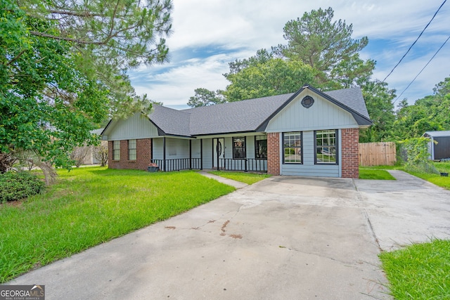 755 Madison Dr, Hinesville, GA 31313 - single story home featuring brick siding, a porch, a shingled roof, and driveway