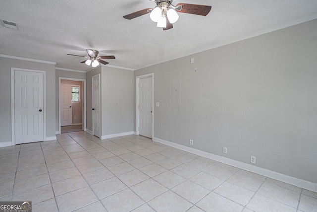755 Madison Dr, Hinesville, GA 31313 - empty room with a ceiling fan, a textured ceiling, crown molding, light tile patterned floors, and baseboards
