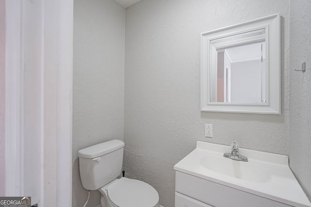 755 Madison Dr, Hinesville, GA 31313 - half bathroom featuring vanity and toilet