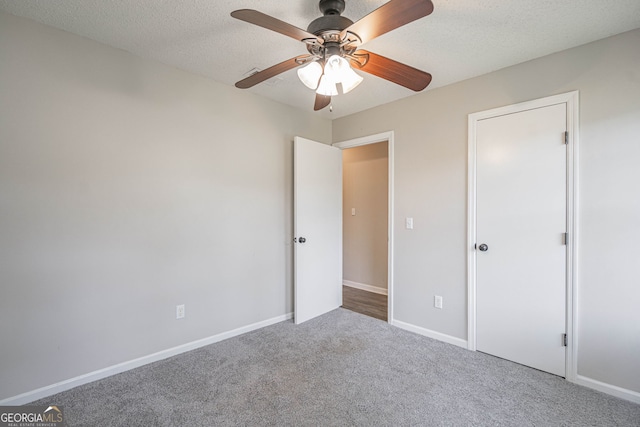 755 Madison Dr, Hinesville, GA 31313 - unfurnished bedroom featuring carpet, baseboards, and a ceiling fan