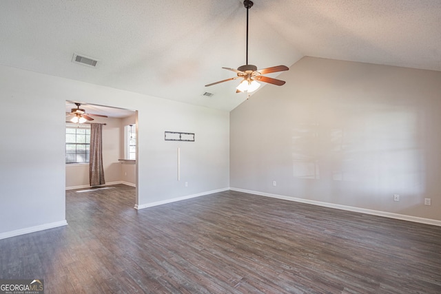 755 Madison Dr, Hinesville, GA 31313 - empty room featuring ceiling fan, dark wood finished floors, vaulted ceiling, a textured ceiling, and baseboards