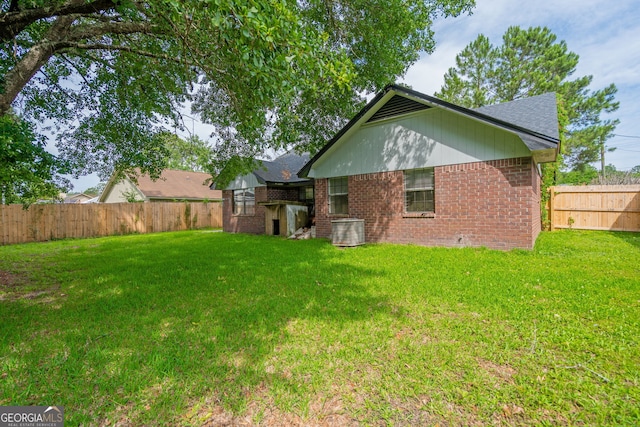 755 Madison Dr, Hinesville, GA 31313 - rear view of house with brick siding and central AC