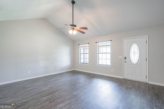 755 Madison Dr, Hinesville, GA 31313 - entrance foyer with ceiling fan, vaulted ceiling, dark wood finished floors, baseboards, and a textured ceiling