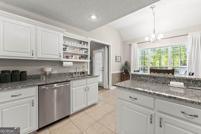 92 Isaiah Dr, Jefferson, GA 30549 - kitchen featuring dishwasher, a sink, lofted ceiling, light tile patterned floors, and a chandelier