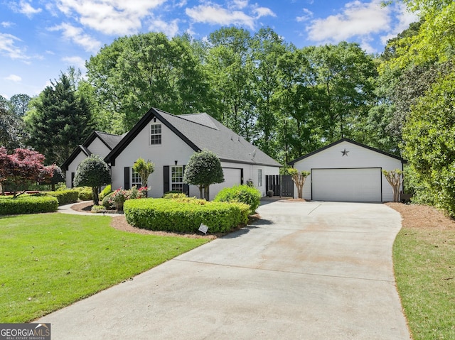 92 Isaiah Dr, Jefferson, GA 30549 - view of front of home featuring an outdoor structure, a front lawn, and a detached garage