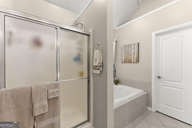 92 Isaiah Dr, Jefferson, GA 30549 - full bath with a garden tub, a shower stall, tile patterned flooring, and lofted ceiling