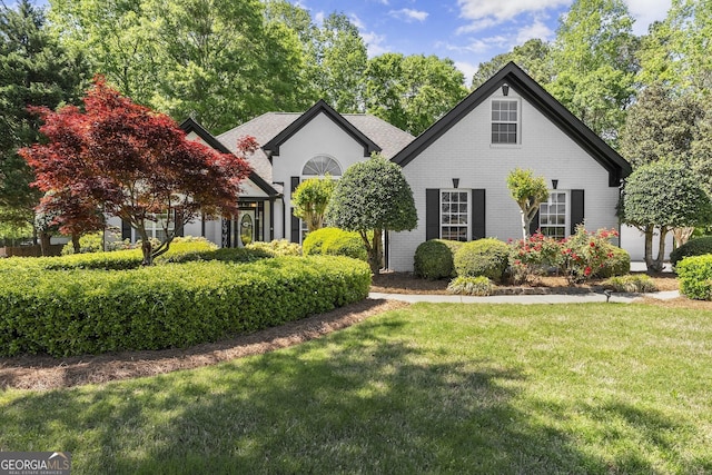 92 Isaiah Dr, Jefferson, GA 30549 - view of front of house with brick siding and a front lawn
