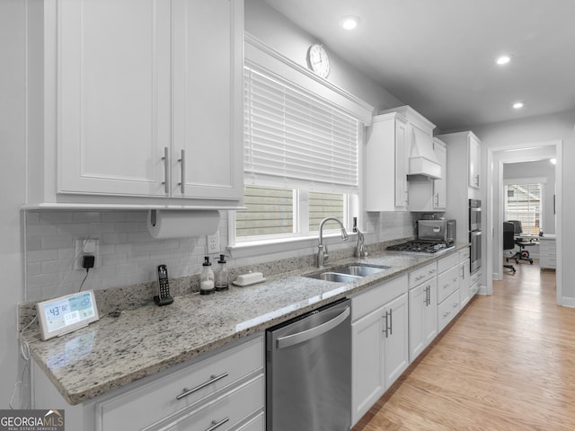 110 Chinkapin Ct, Griffin, GA 30223 - kitchen with stainless steel appliances, a sink, decorative backsplash, white cabinets, and recessed lighting