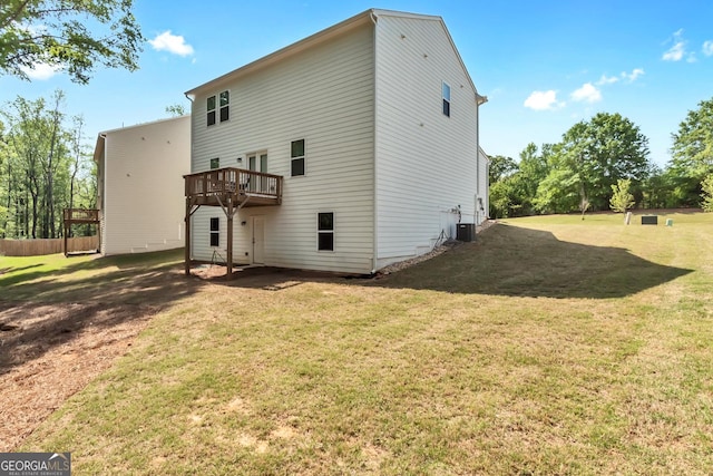 289 Pond Ct, Hoschton, GA 30548 - back of house featuring a lawn, a deck, and central AC