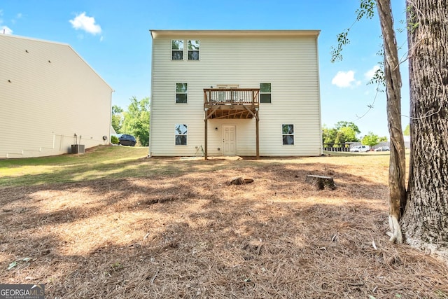 289 Pond Ct, Hoschton, GA 30548 - back of property featuring central AC and a deck