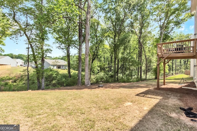 289 Pond Ct, Hoschton, GA 30548 - view of green lawn with a wooden deck