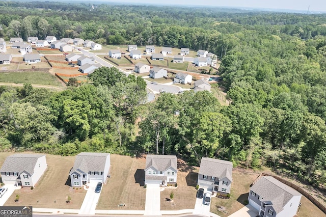 289 Pond Ct, Hoschton, GA 30548 - aerial perspective of suburban area featuring a forest