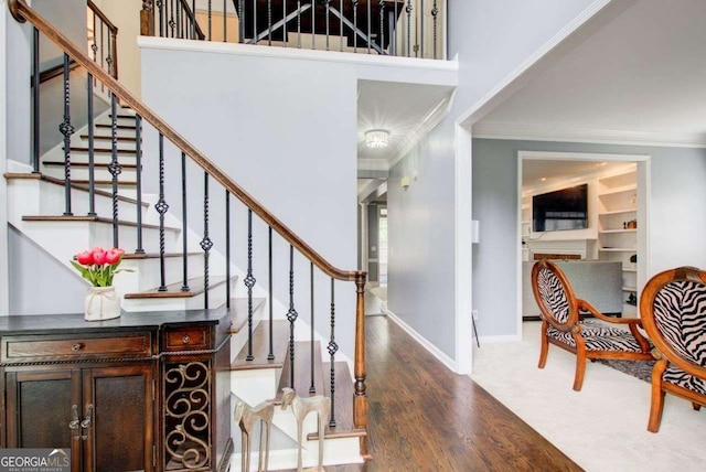 1870 Milfield Cir, Snellville, GA 30078 - stairs with crown molding, wood finished floors, and a high ceiling