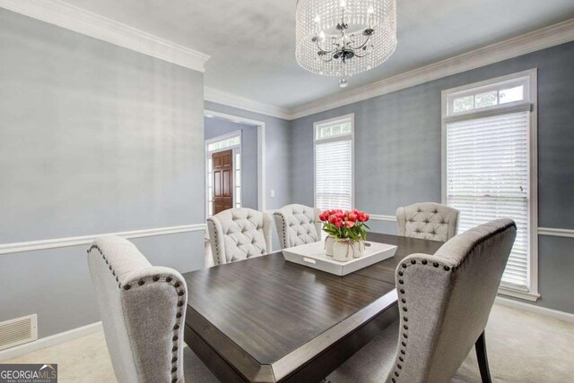 1870 Milfield Cir, Snellville, GA 30078 - dining area with a chandelier, healthy amount of natural light, light carpet, and ornamental molding