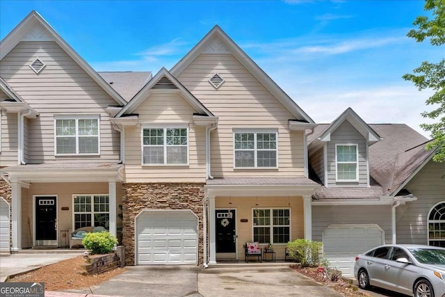 2205 Hoskin Ct NW Unit 9, Kennesaw, GA 30144 - townhome / multi-family property with an attached garage, driveway, and stone siding