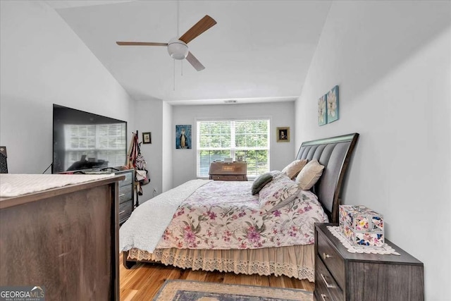 2205 Hoskin Ct NW Unit 9, Kennesaw, GA 30144 - bedroom with vaulted ceiling, wood finished floors, and a ceiling fan