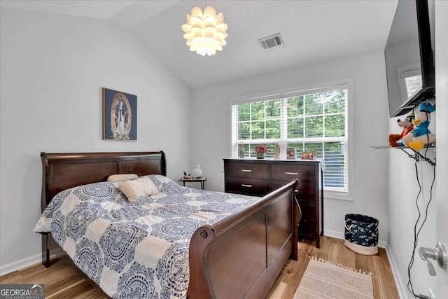 2205 Hoskin Ct NW Unit 9, Kennesaw, GA 30144 - bedroom with light wood finished floors, baseboards, and vaulted ceiling