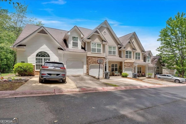 2205 Hoskin Ct NW Unit 9, Kennesaw, GA 30144 - view of front of property featuring a garage, driveway, and stone siding