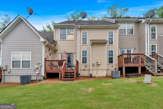 2205 Hoskin Ct NW Unit 9, Kennesaw, GA 30144 - back of house featuring a deck, a lawn, and central AC