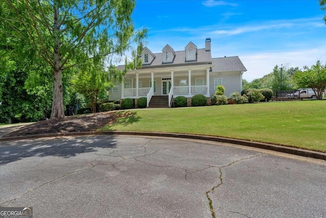 2205 Hoskin Ct NW Unit 9, Kennesaw, GA 30144 - cape cod-style house featuring covered porch, a front yard, and a chimney