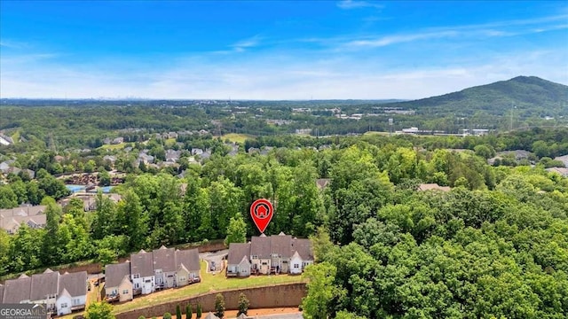 2205 Hoskin Ct NW Unit 9, Kennesaw, GA 30144 - aerial perspective of suburban area featuring a forest and a mountainous background