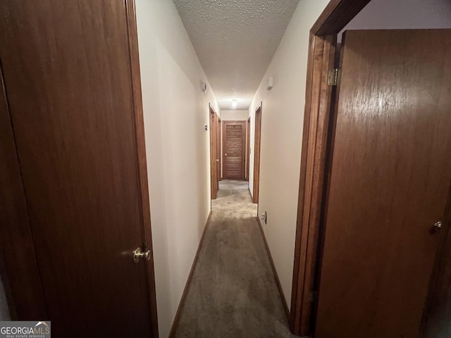21 Cannon Cir NW, Cartersville, GA 30120 - corridor with carpet floors, a textured ceiling, and baseboards