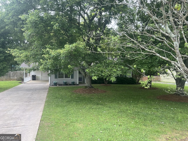 21 Cannon Cir NW, Cartersville, GA 30120 - obstructed view of property featuring concrete driveway and a carport