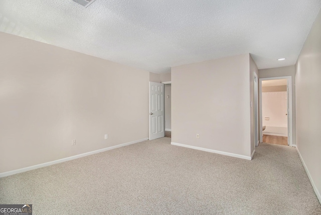2220 Runnymead Rdg SE, Marietta, GA 30067 - unfurnished room with light carpet, baseboards, a textured ceiling, and recessed lighting