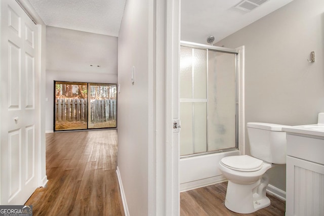 2220 Runnymead Rdg SE, Marietta, GA 30067 - full bathroom featuring wood finished floors, vanity, toilet, enclosed tub / shower combo, and baseboards