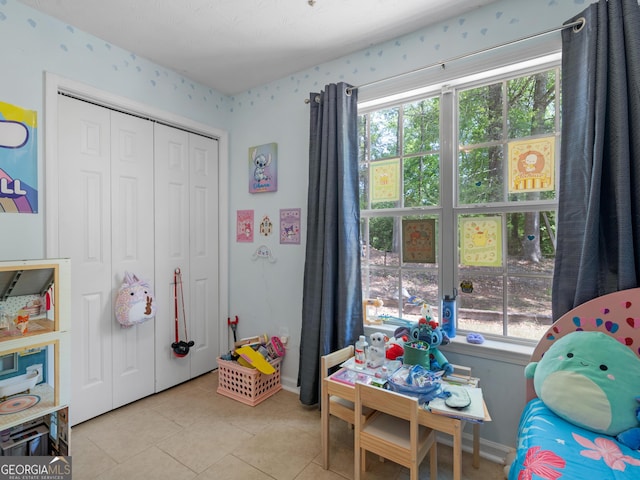 2040 Elm Grove Ln, Hampton, GA 30228 - recreation room featuring plenty of natural light, light tile patterned floors, and baseboards