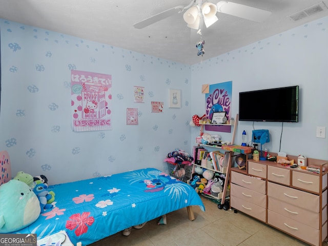 2040 Elm Grove Ln, Hampton, GA 30228 - bedroom featuring wallpapered walls, light tile patterned floors, and a ceiling fan