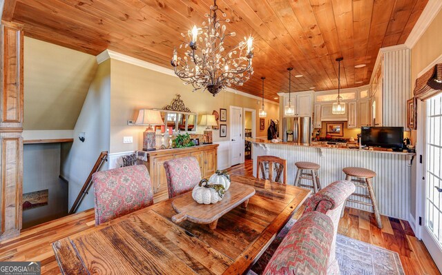1420 Bridge Creek Rd, Tiger, GA 30576 - dining space featuring ornamental molding, wooden ceiling, light wood finished floors, and a chandelier