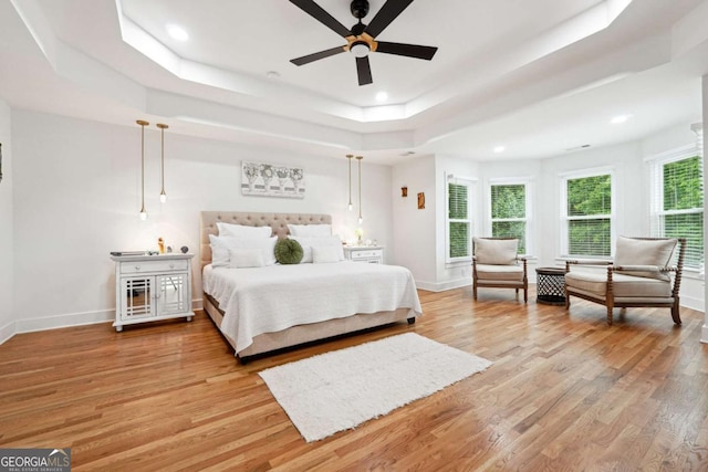 5535 Buck Hollow Dr, Alpharetta, GA 30005 - bedroom featuring a tray ceiling, light wood finished floors, recessed lighting, and a ceiling fan