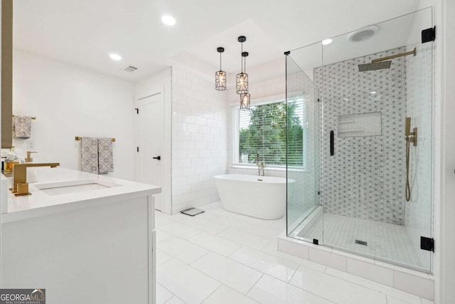 5535 Buck Hollow Dr, Alpharetta, GA 30005 - bathroom featuring a freestanding bath, a shower stall, tile patterned flooring, vanity, and recessed lighting