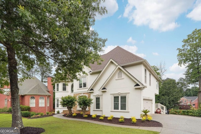 5535 Buck Hollow Dr, Alpharetta, GA 30005 - view of front of property with driveway, stucco siding, a garage, a front yard, and a shingled roof