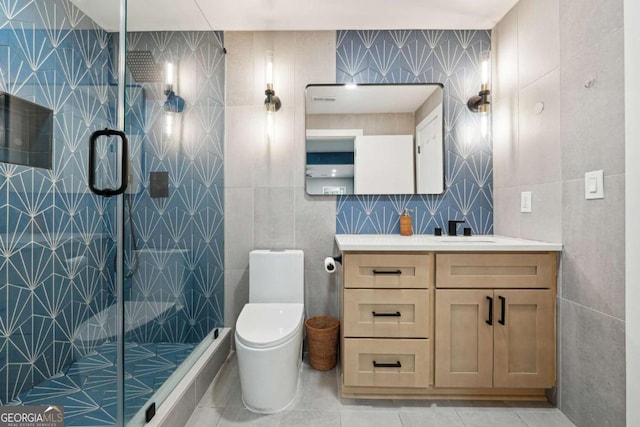 5535 Buck Hollow Dr, Alpharetta, GA 30005 - full bathroom featuring tile walls, vanity, a shower stall, and tile patterned floors