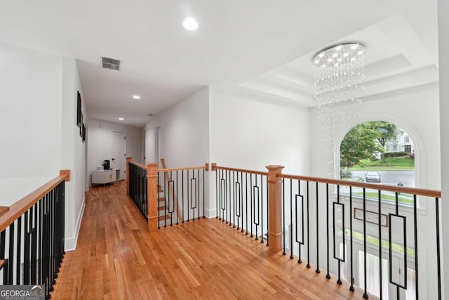 5535 Buck Hollow Dr, Alpharetta, GA 30005 - hall with a chandelier, an upstairs landing, wood finished floors, recessed lighting, and a raised ceiling