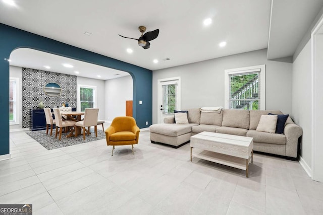 5535 Buck Hollow Dr, Alpharetta, GA 30005 - living room featuring arched walkways, a ceiling fan, recessed lighting, and light tile patterned floors