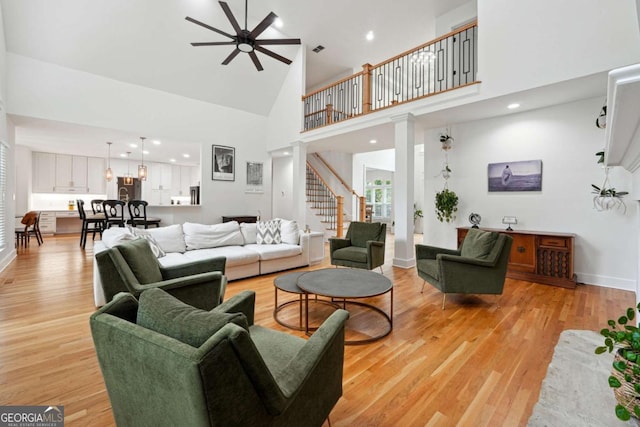 5535 Buck Hollow Dr, Alpharetta, GA 30005 - living area with a ceiling fan, high vaulted ceiling, stairway, light wood-style flooring, and recessed lighting