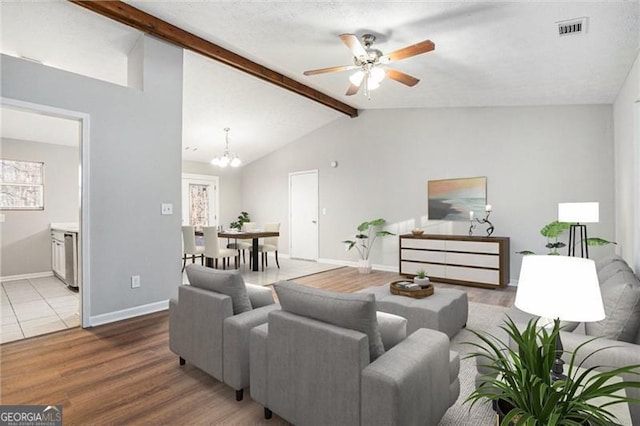 3448 Great Meadows Ct, Lithonia, GA 30038 - living room with wood finished floors, a chandelier, a ceiling fan, and baseboards
