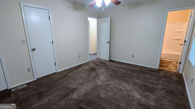 2168 Sara Ashley Way, Lithonia, GA 30058 - unfurnished bedroom featuring carpet, ensuite bathroom, and ceiling fan