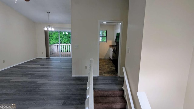 2168 Sara Ashley Way, Lithonia, GA 30058 - staircase with wood finished floors, a ceiling fan, and a chandelier