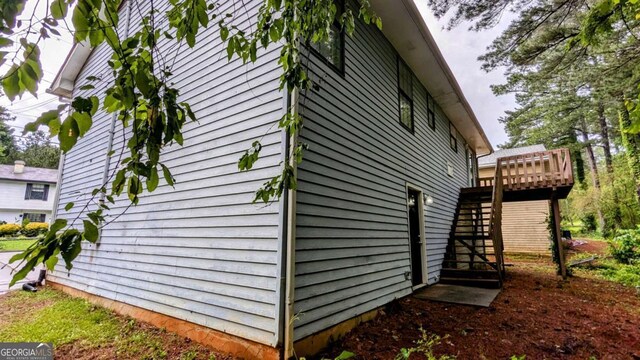 2168 Sara Ashley Way, Lithonia, GA 30058 - view of home's exterior featuring stairway and a wooden deck