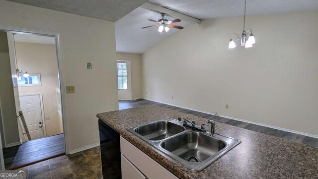 2168 Sara Ashley Way, Lithonia, GA 30058 - kitchen with black dishwasher, a chandelier, dark countertops, and open floor plan