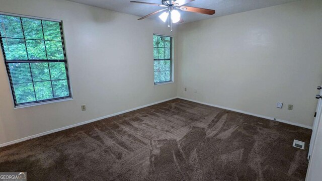 2168 Sara Ashley Way, Lithonia, GA 30058 - empty room with carpet and a ceiling fan