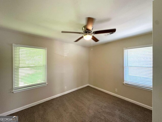 2469 Baywood Dr SE, Atlanta, GA 30315 - unfurnished room featuring ceiling fan, dark colored carpet, and baseboards