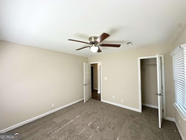 2469 Baywood Dr SE, Atlanta, GA 30315 - unfurnished bedroom with carpet flooring, baseboards, ceiling fan, a closet, and a spacious closet