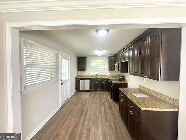 2469 Baywood Dr SE, Atlanta, GA 30315 - kitchen featuring stainless steel appliances, a sink, wood finished floors, dark brown cabinetry, and baseboards