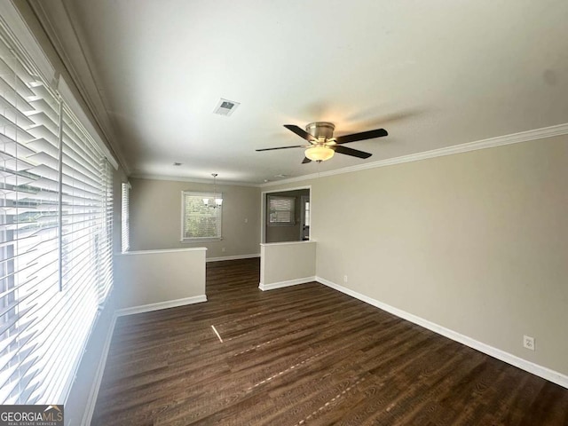 2469 Baywood Dr SE, Atlanta, GA 30315 - unfurnished room with baseboards, a chandelier, dark wood finished floors, ceiling fan, and ornamental molding